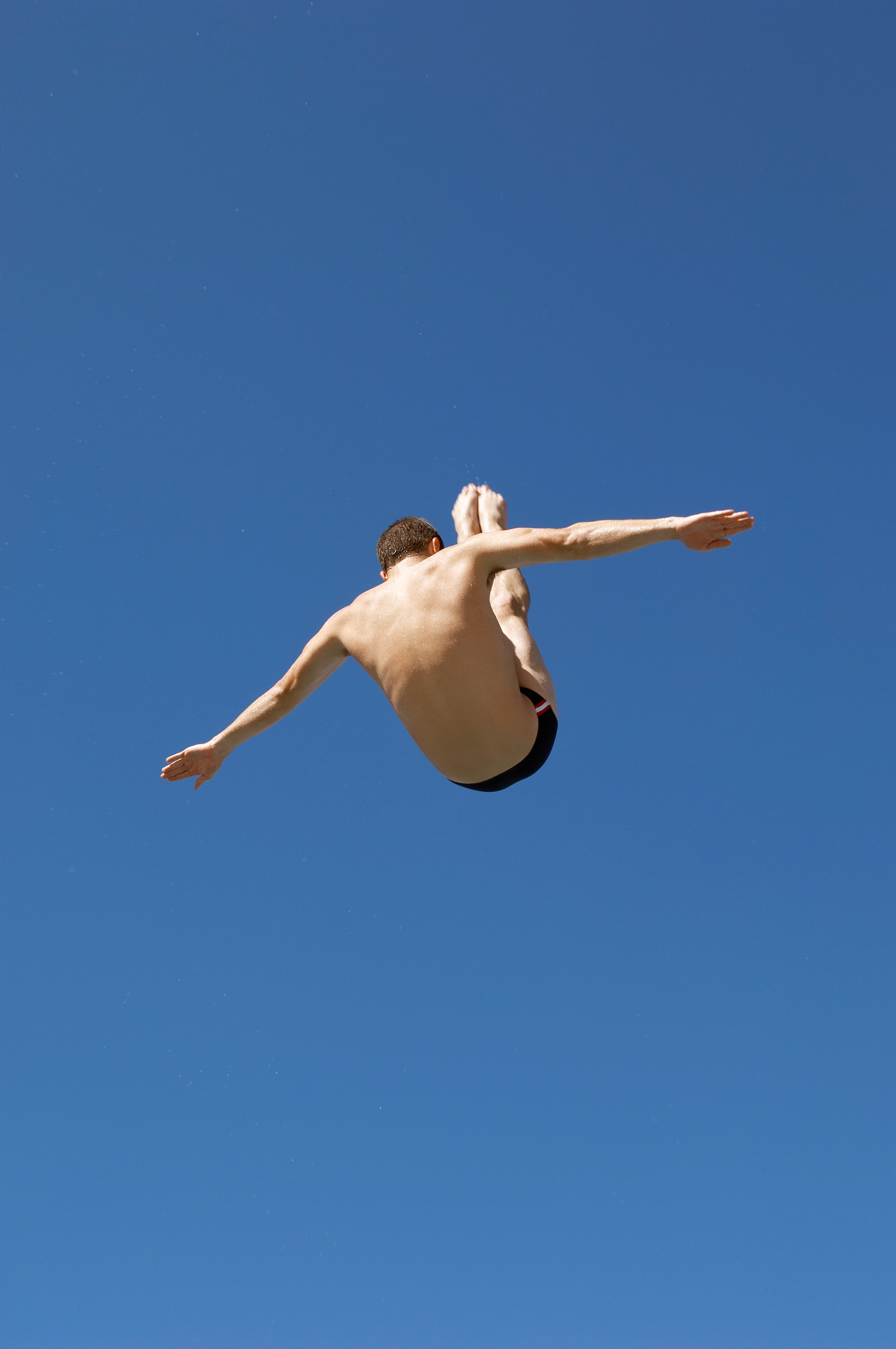 Platform diver in flight